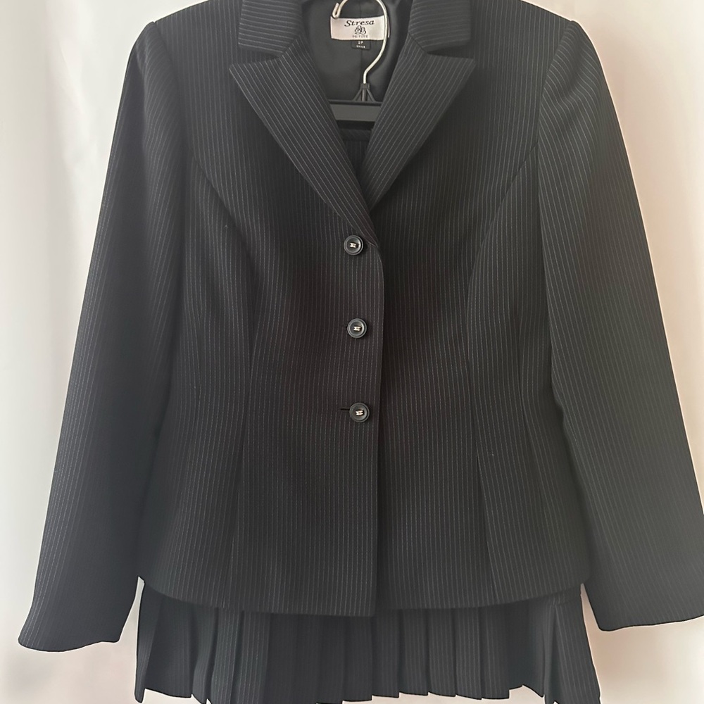 Black Pinstriped Suit with Tailored Silhouette and Interesting Design